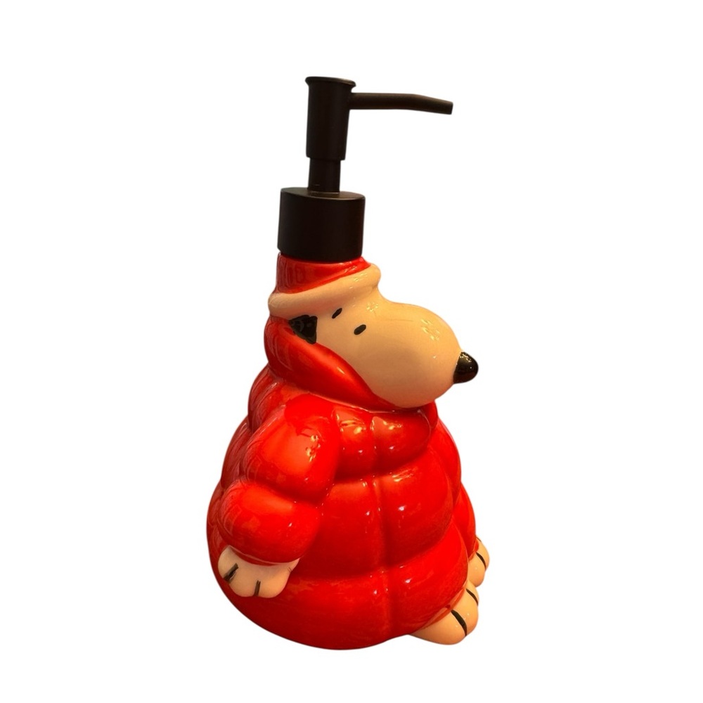 Snoopy in a puffer coat soap dispenser